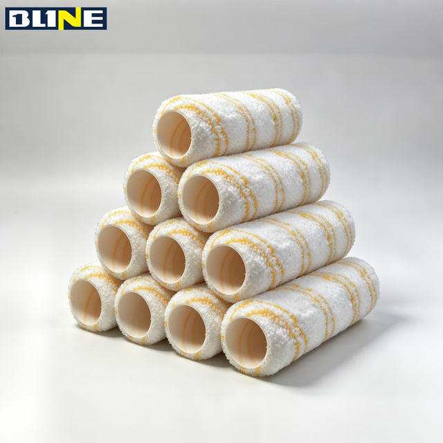 Paint roller with white base and yellow stripes