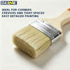 Paint brush with red marked handle